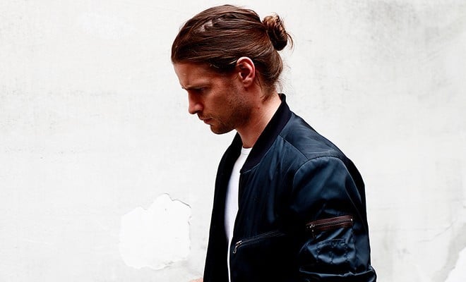 A photo of a man wearing a Bomber jacket. 